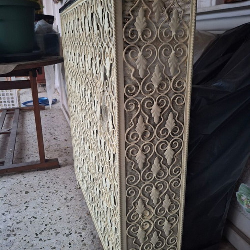Vintage metal radiator cover with embossed design