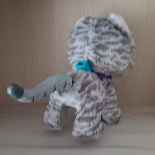 Plush feline doll used with sound