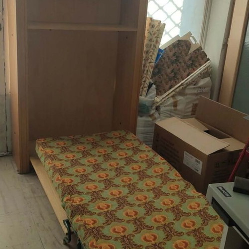 Bookcase with foldable bed used