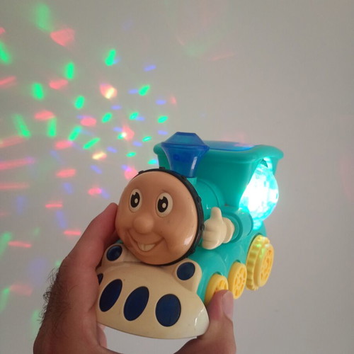 Cute Train toy with sounds, lights and movement, used