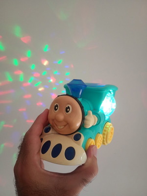 Cute Train toy with sounds, lights and movement, used