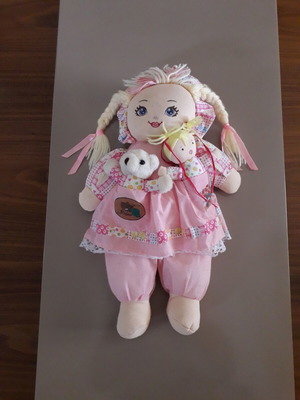Cloth doll with 2 small dolls