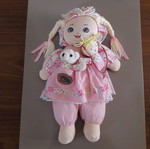 Cloth doll with 2 small dolls