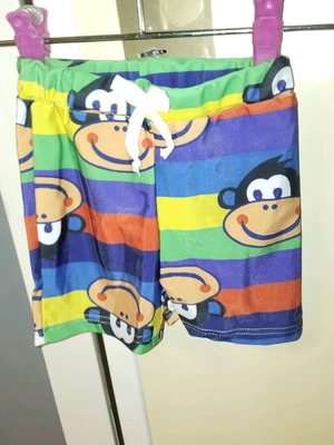 Children's swim shorts with cartoon monkey design and colorful elastic waist