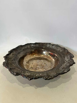 Vintage silver-plated fruit bowl with embossed designs and wavy rim