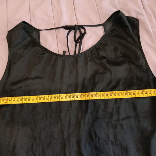Black loose sleeveless top with back tie like new