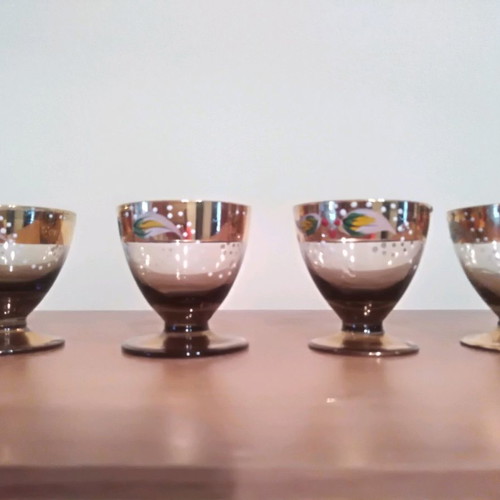 Liqueur glasses used, 4 handmade painted and 5 carved crystal