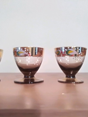 Liqueur glasses used, 4 handmade painted and 5 carved crystal