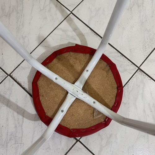 Stool with metal legs and red seat like new