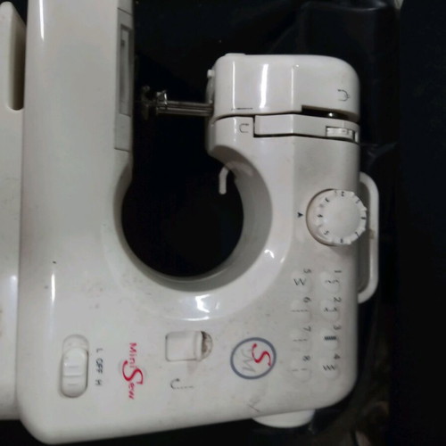 Mini sewing machine used for parts or decor, battery operated