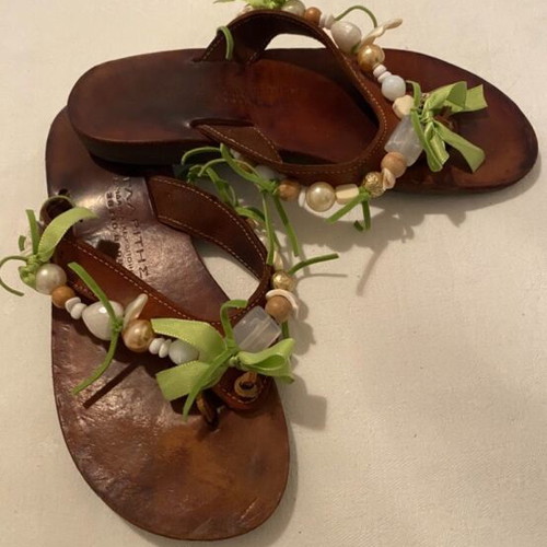 Leather slippers like new, decorated with beads and green ribbons, size 36
