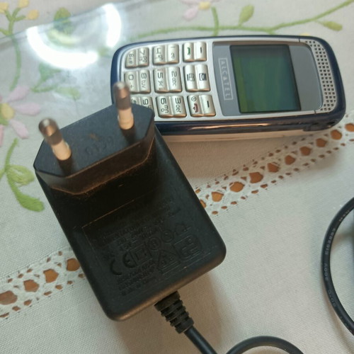 Alcatel mobile phone used, non-functional, with original charger
