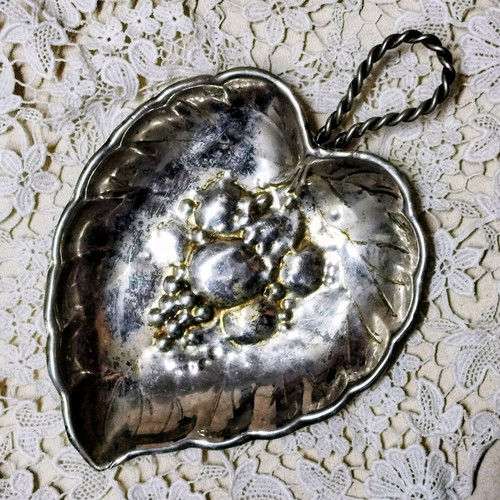 Vintage silver plated leaf-shaped plate used with embossed design