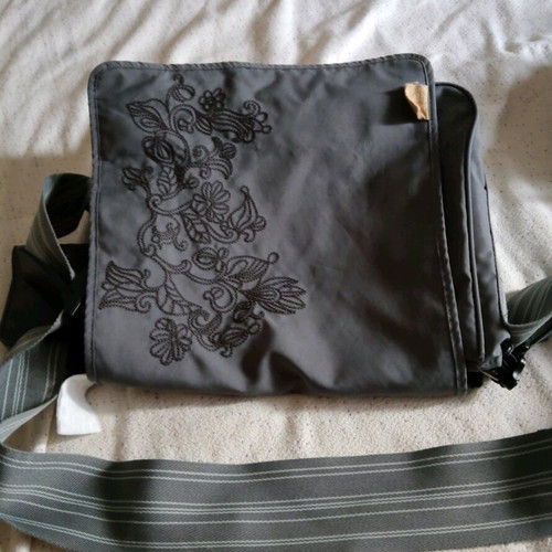 Lassig changing bag used, messenger with strap and spacious compartments