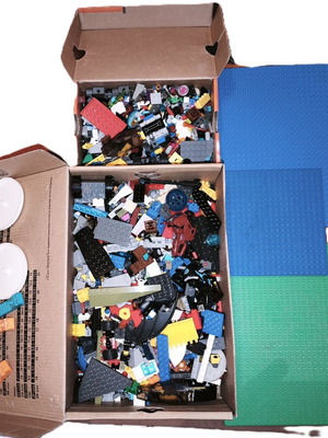 Lego boxes with pieces from various sets and 3 bases used