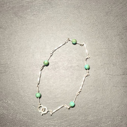 Silver bracelet with green beads used, needs repair