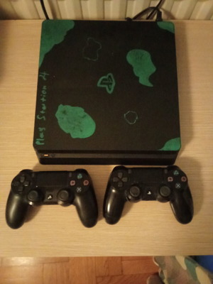 Sony PlayStation 4 Slim 500GB used with 5 games and 2 controllers