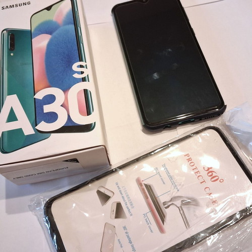 Samsung Galaxy A30s phone used with 2 cases included