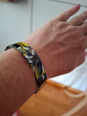 Plastic bracelet like bone colored like new