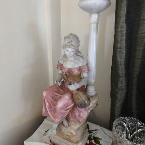 Statue of a woman playing a lute