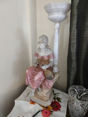 Statue of a woman playing a lute