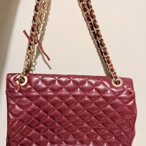 Italian leather shoulder bag used with wear on corners and chain