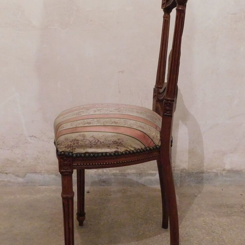 Pair of carved wooden chairs with striped fabric seat like new