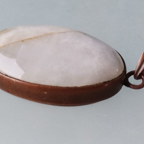 Metal necklace with oval moonstone semi-precious stone used