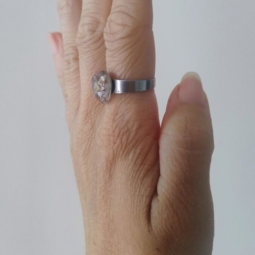Floral ring handmade with lilac flowers in epoxy resin