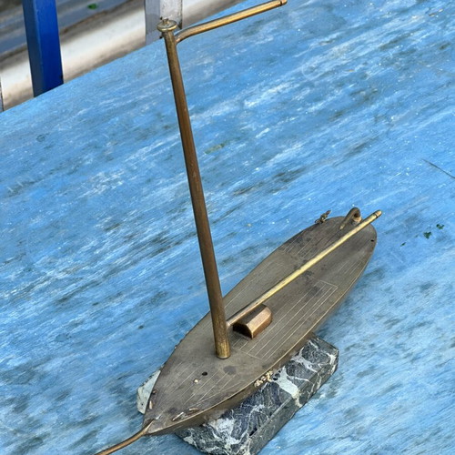 Vintage brass sailboat decoration on marble base, used