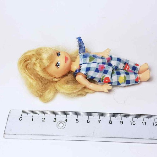 Plastic doll used with torn clothes