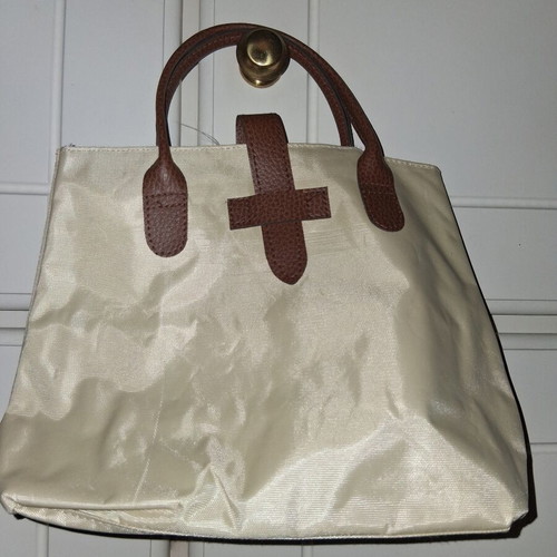 Handbag like new, small beige with brown leather handles and clasp