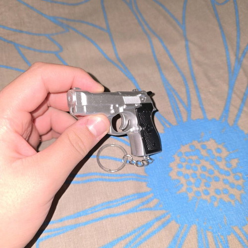 Lazer flashlight keychain in gun shape like new