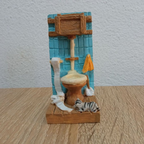 Toilet decoration with cat figurine used