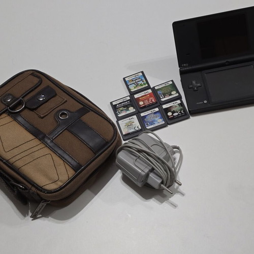 Nintendo DSi black console pack used with 7 games, charger and travel case