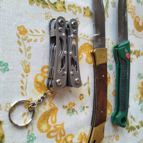 Multitool with two pocket knives used