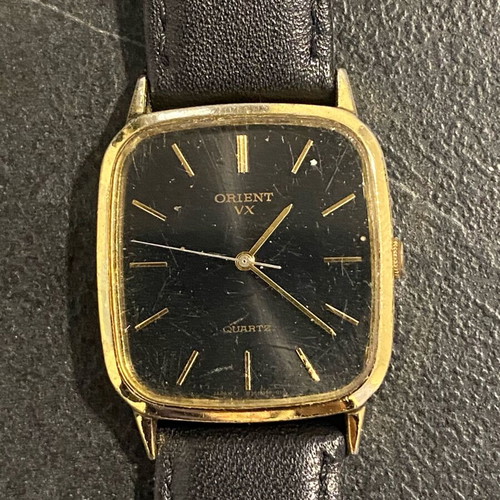 Orient VX used, needs battery, black and gold