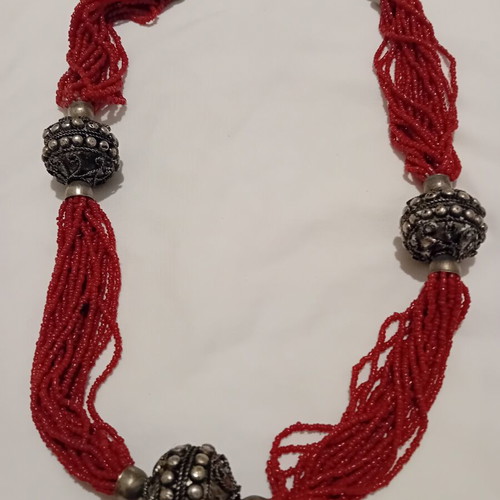 Red multistrand necklace with silver beads used