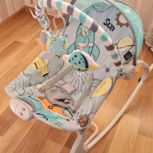 Musical bouncer like new with safety belt for baby