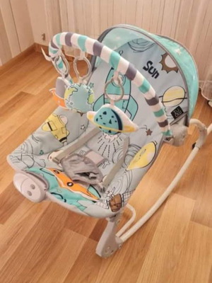 Musical bouncer like new with safety belt for baby