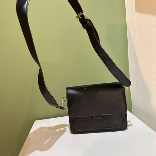 Black women's crossbody shoulder bag with gold details
