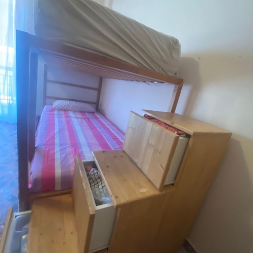 Kura bed used with convertible bunk and storage drawers