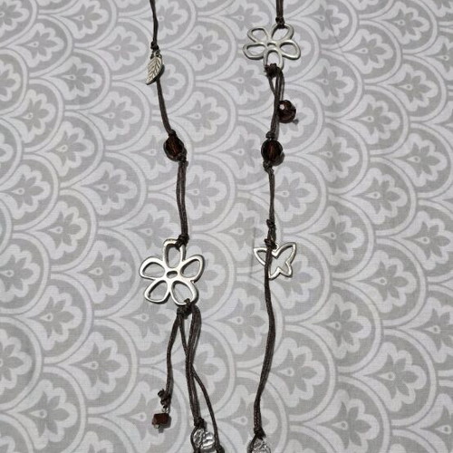 Necklace with beads and silver designs like new, brown and silver