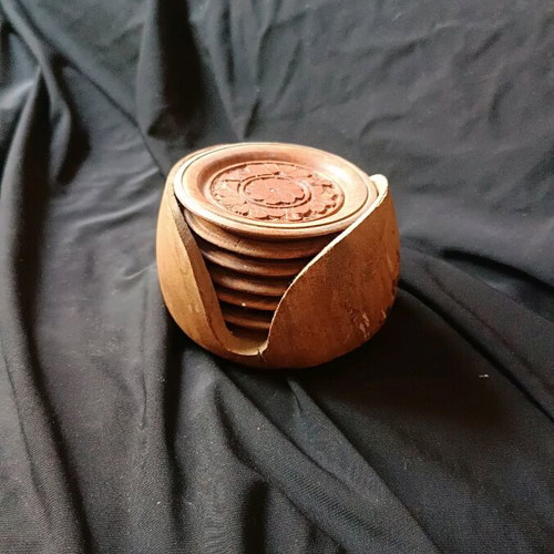 Wooden vintage hand-carved coasters used