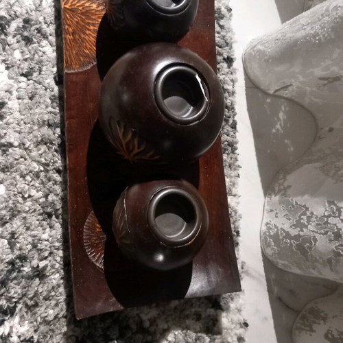 Plate with three wooden candlesticks used