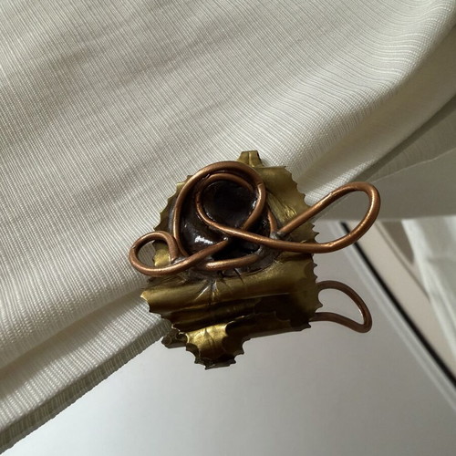 Handmade brooch with copper spiral and black stone, new