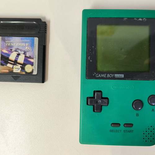 Game Boy Pocket Green console used with Test Drive 6 game