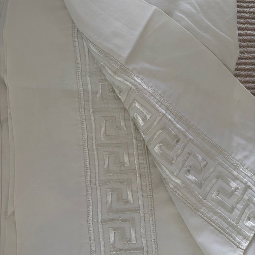 Set of embroidered cotton bed sheets, pillowcases and duvet covers