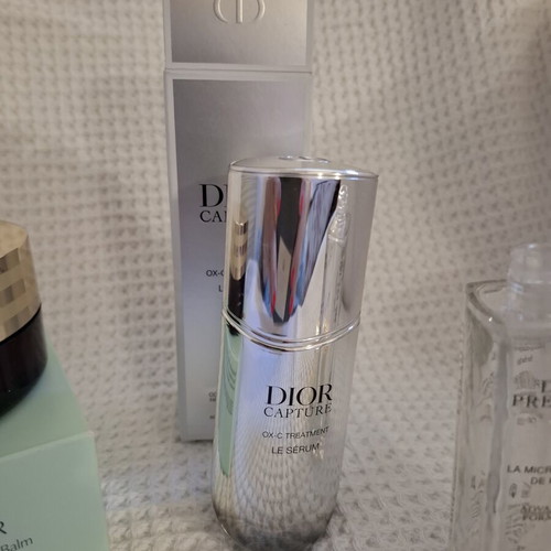 Empty Dior and Estèe Lauder cosmetic jars used, set