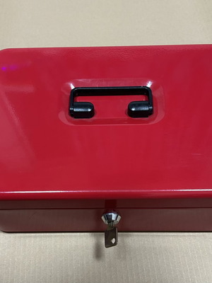 Red metal cash box with lock and key